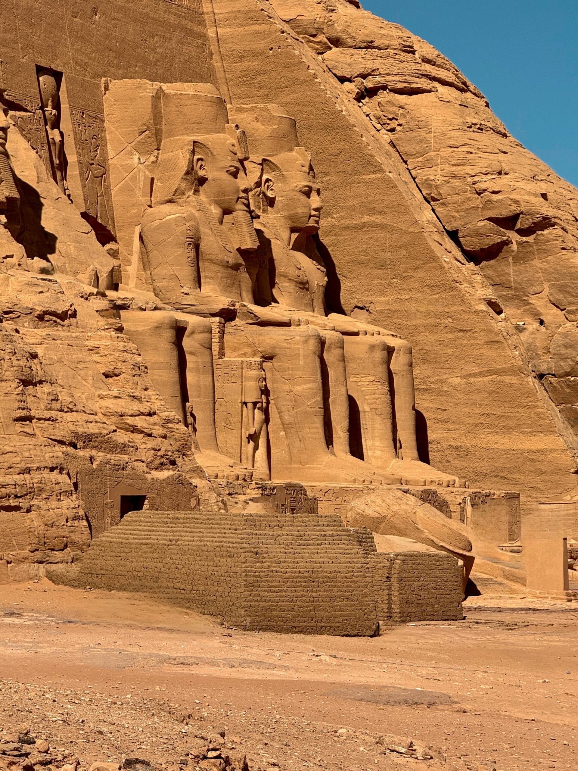 Majestic statues of Abu Simbel in Egypt captured in natural light, showcasing ancient Egyptian architecture.
